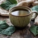 Papalo tea in ceramic mug with fresh papalo leaves